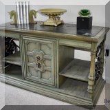F45. Green console table with wrought metal scrollwork and faux stone top. 28.5”h x 48”w x 20.5”d 